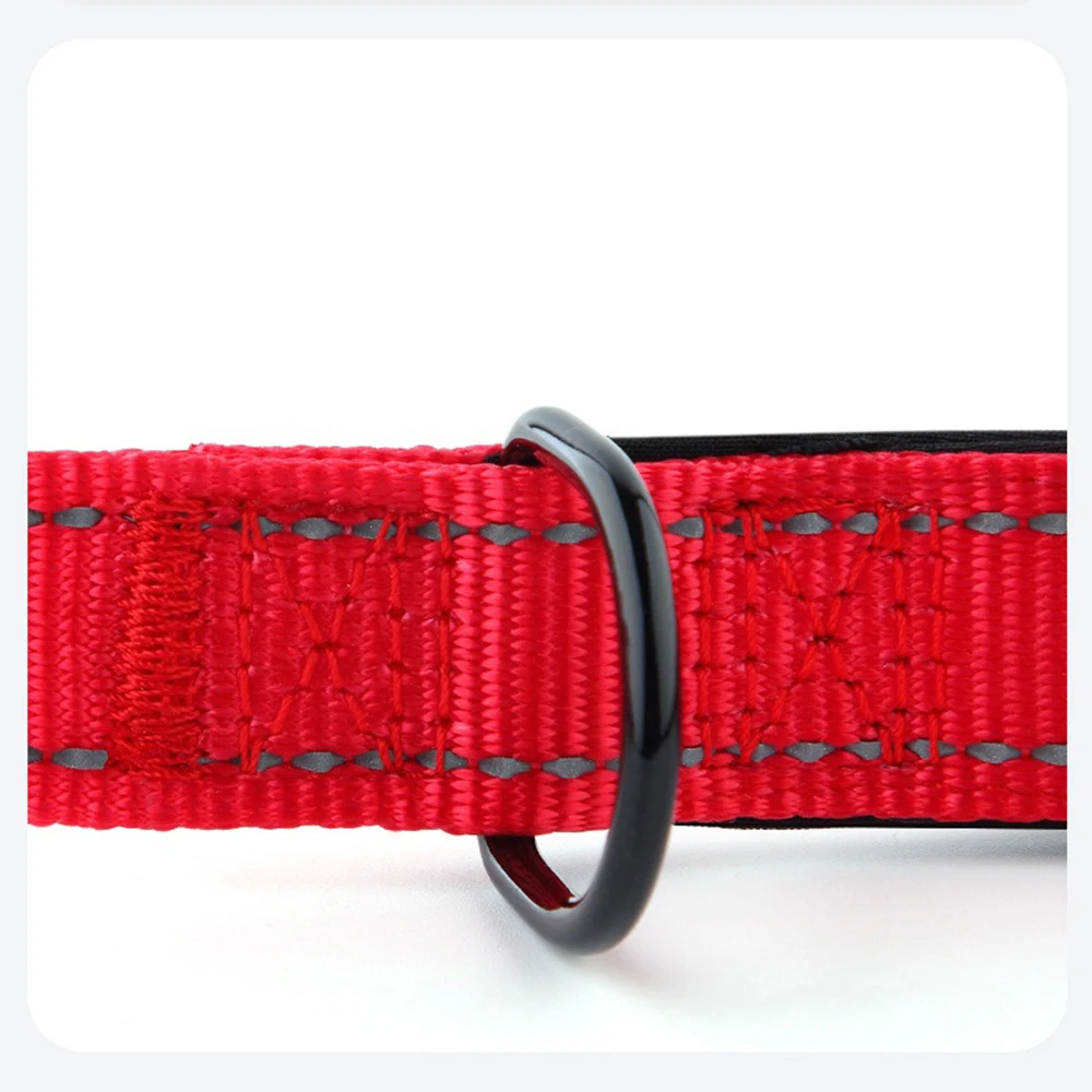 Red lifting sling with gray stitching and a black D-ring connector on a white background.