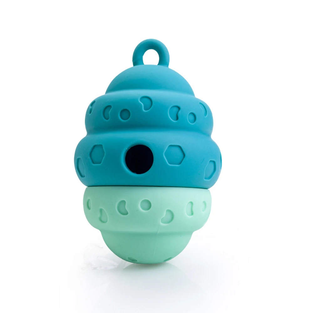 Teal and mint green silicone dog chew toy with treat dispensing holes and loop handle