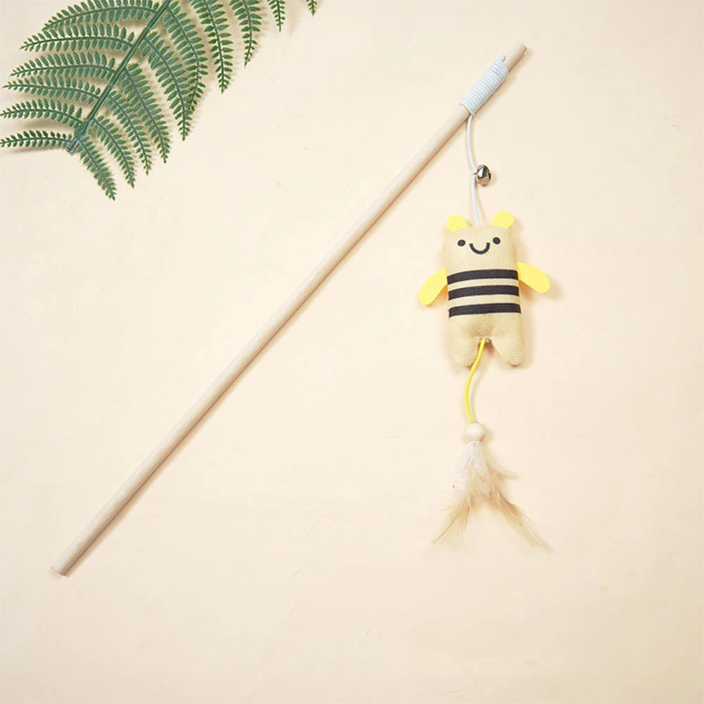 A cat teaser wand with a bee plush toy and feathers attached to a wooden stick.