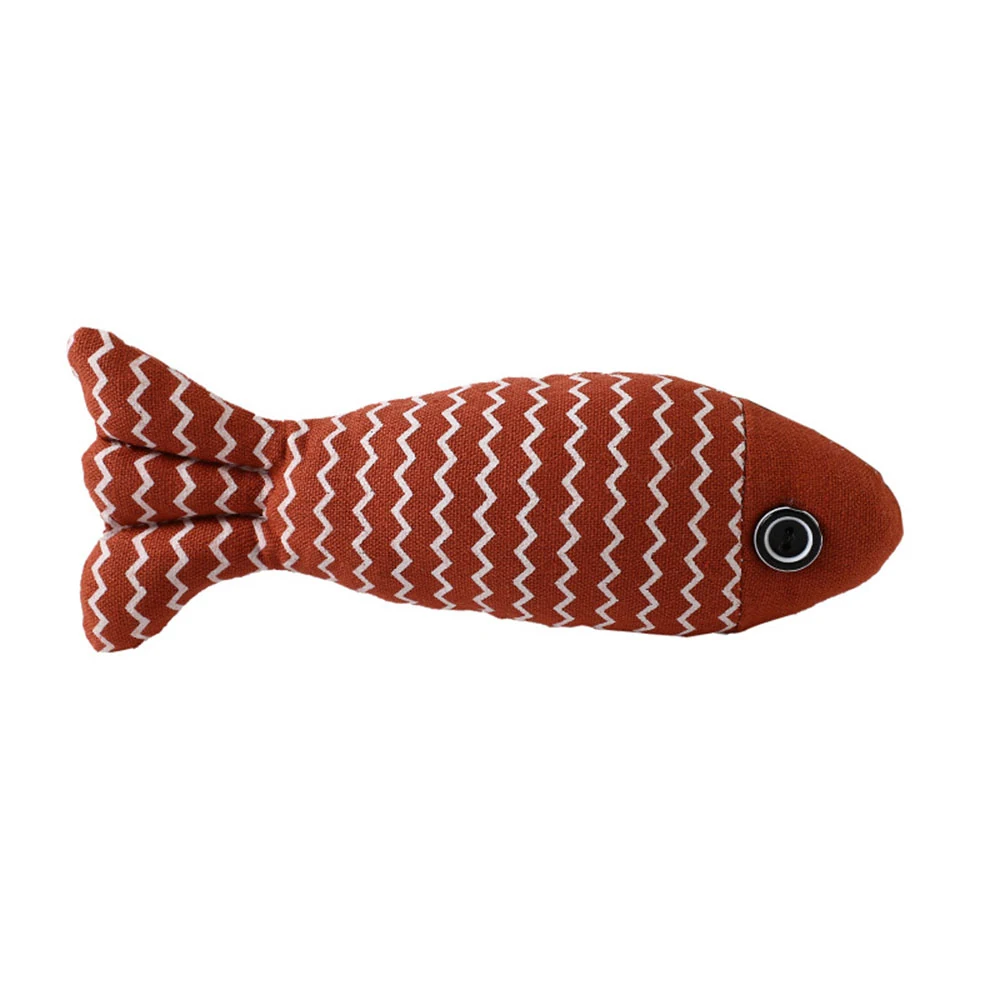 A plush orange fish toy with white zigzag patterns and a button eye on a white background.