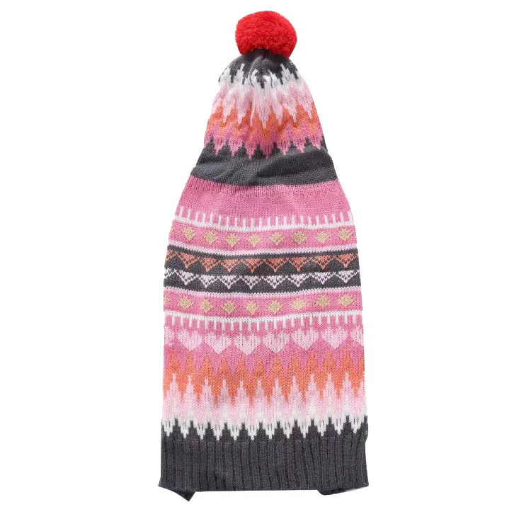A long knitted hat with a red pom pom, featuring a pink, orange, and grey geometric pattern.