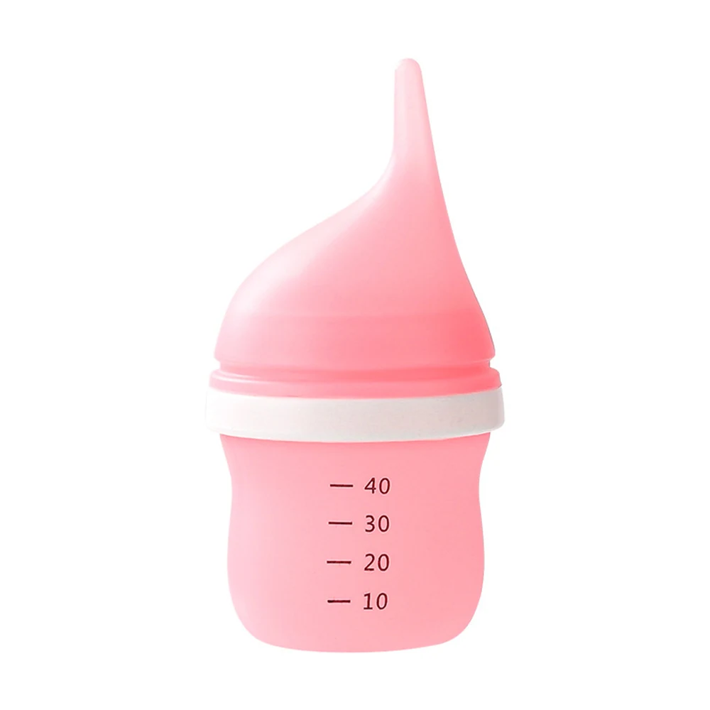 Pink silicone baby food squeeze bottle with white collar and measurement markings on a white background