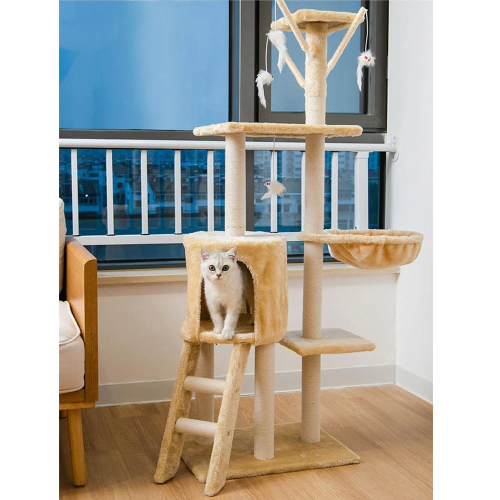Beige carpeted cat tree with a cubby, ladder, and dangling toys, occupied by a white cat in a home setting.