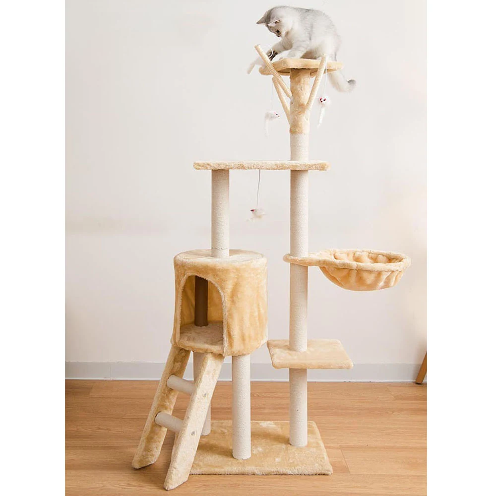 A cat rests on the top perch of a tall, multi-level cat tree with a condo and hammock.