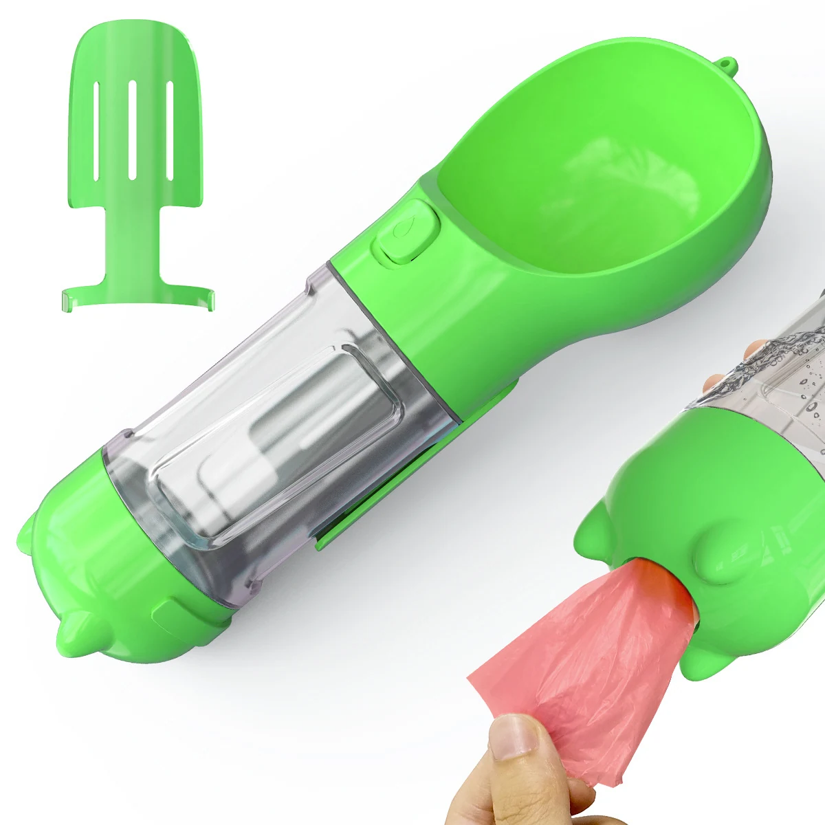 Green plastic baby feeding spoon with a clear reservoir and a pink silicone bag attachment.