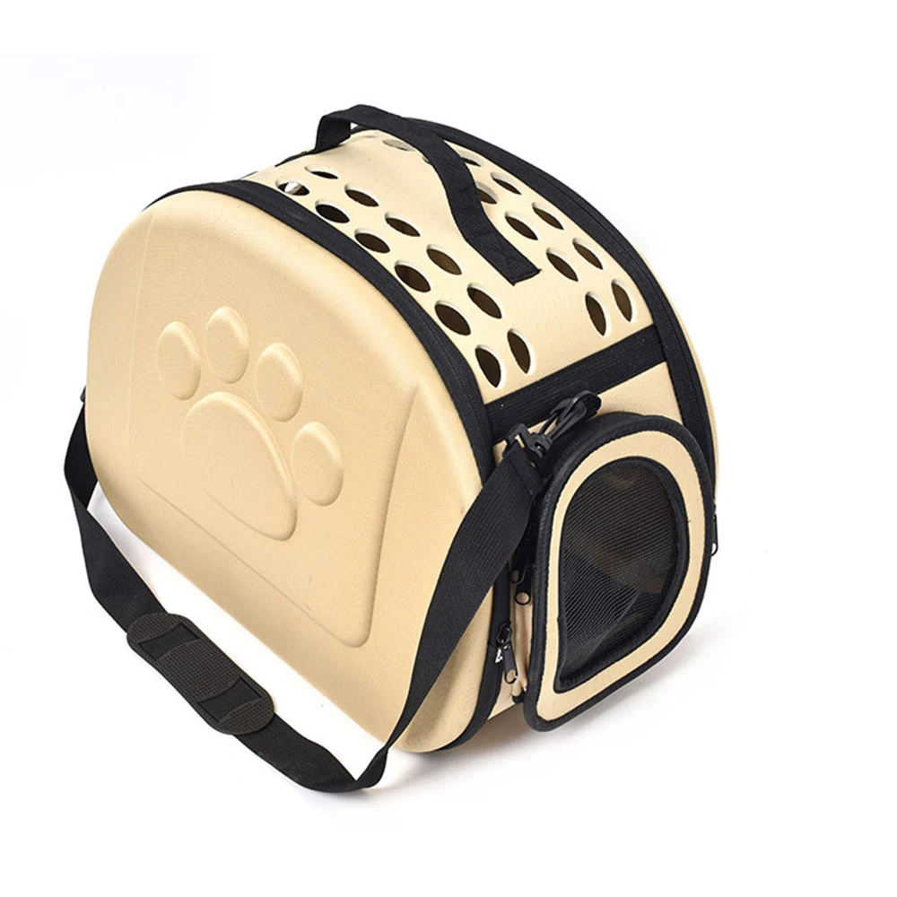 Beige and black pet carrier bag featuring a molded paw print and mesh ventilation window