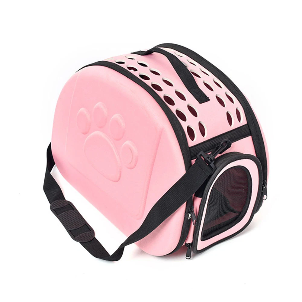 Pink hard-shell pet carrier bag with ventilation holes and a paw print design