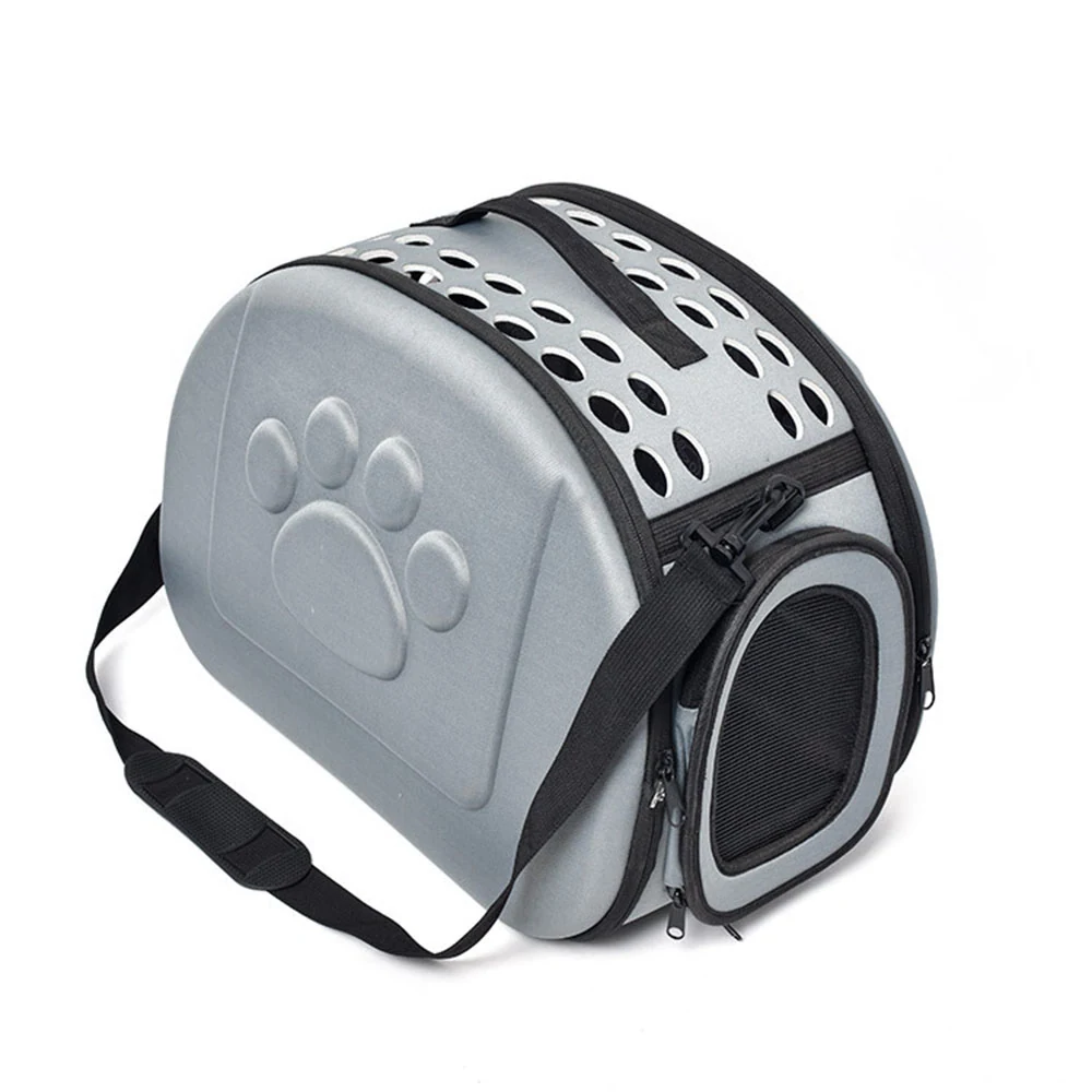 Grey hard-shell pet carrier bag with ventilation holes and a molded paw print design
