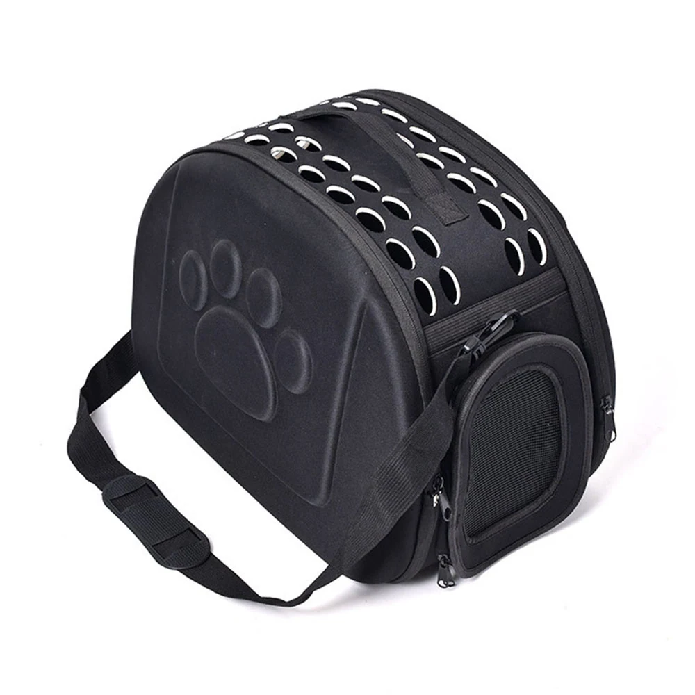 Black pet carrier bag with ventilation holes and a paw print design