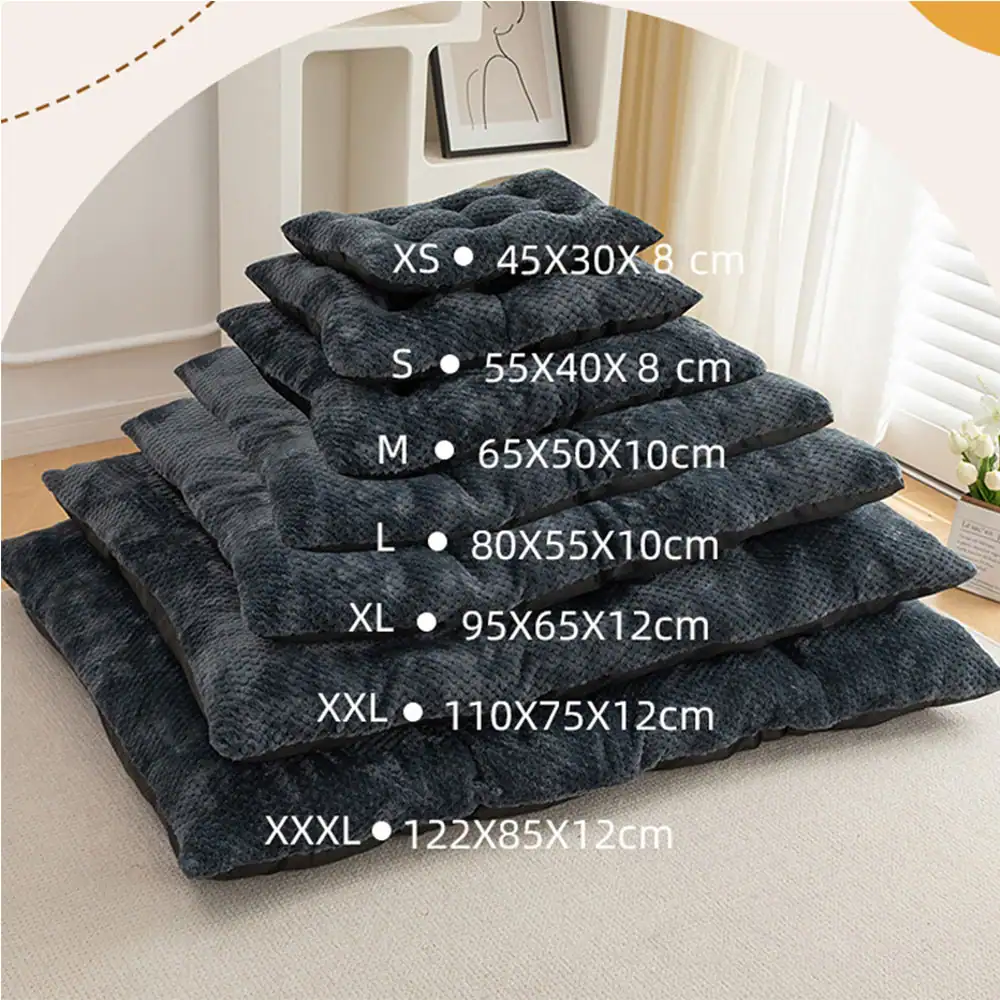 A stack of dark grey tufted pet mats showing size labels from XS to XXXL.