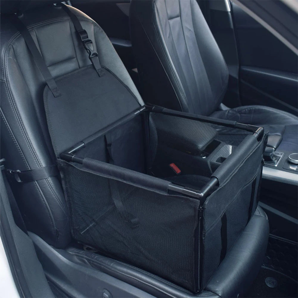 Black mesh car seat barrier installed on a rear vehicle seat