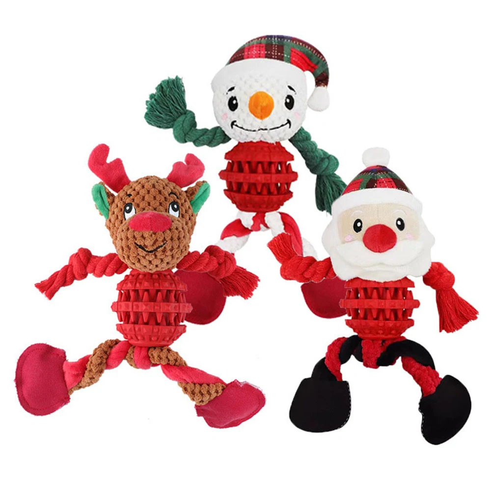 Three plush holiday pet toys: a snowman, a reindeer, and a Santa Claus figure with rope limbs.