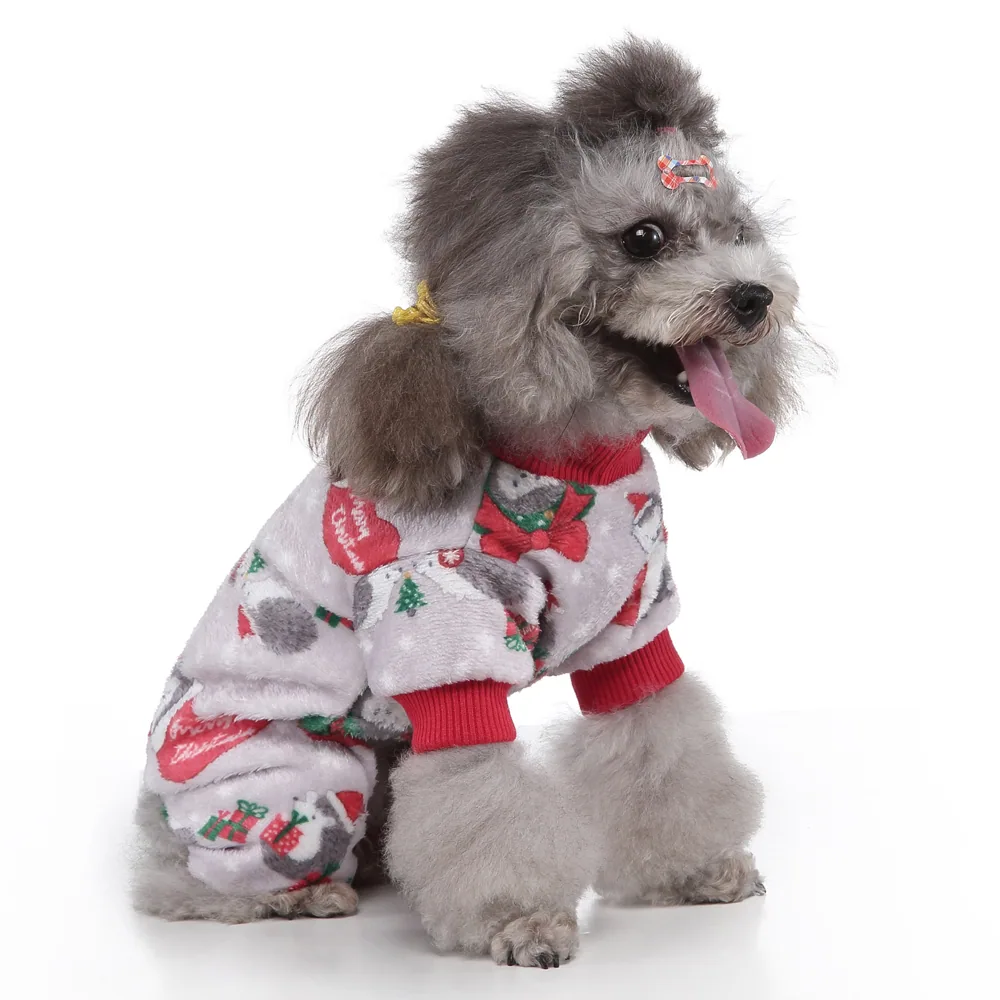 Gray poodle wearing a white fleece Christmas sweater with red trim and holiday patterns