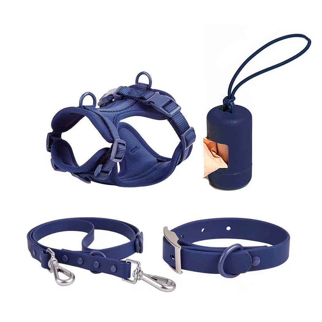 Navy blue dog harness, collar, leash, and poop bag dispenser displayed on a white background