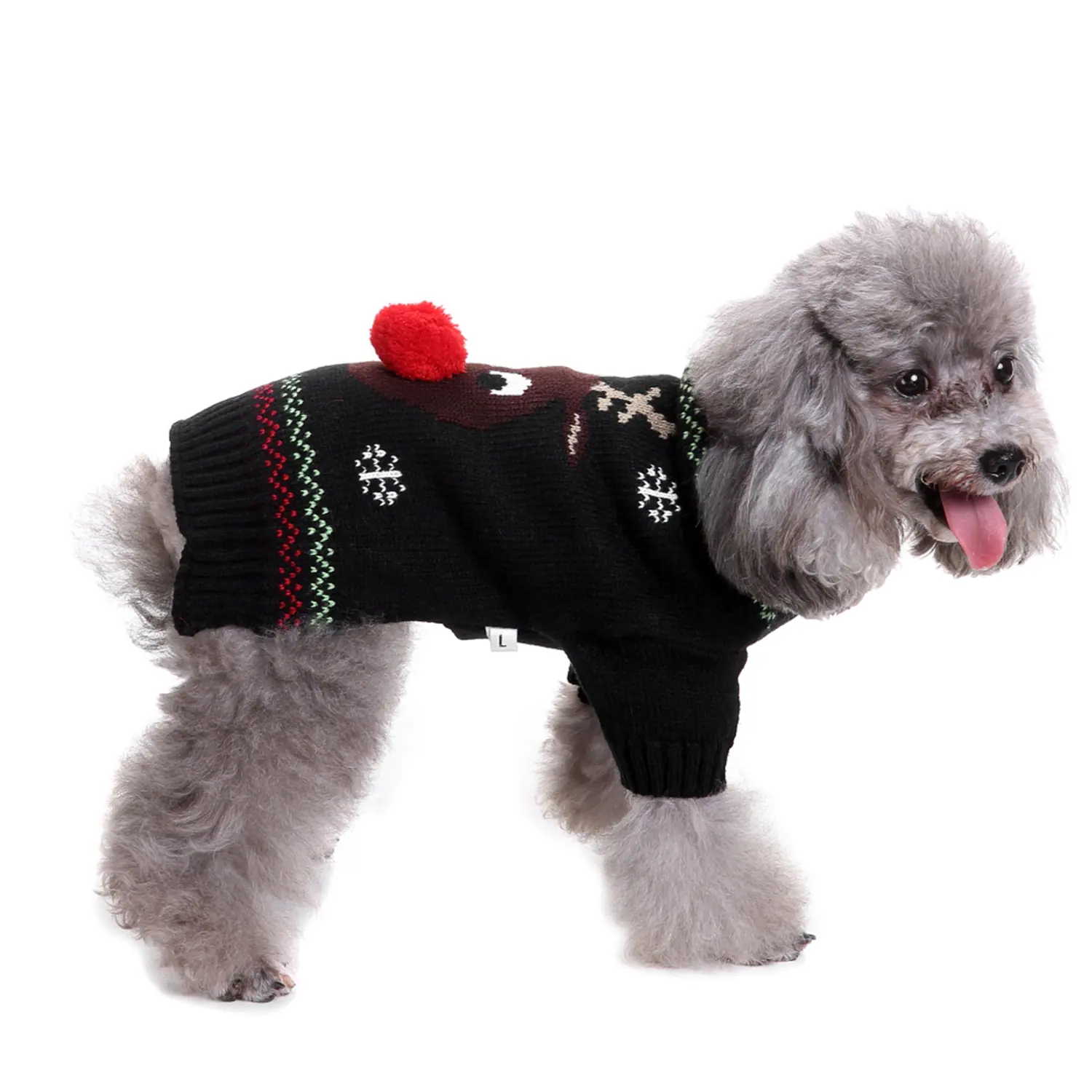 A grey poodle wearing a black knitted Christmas sweater with a red pom-pom.