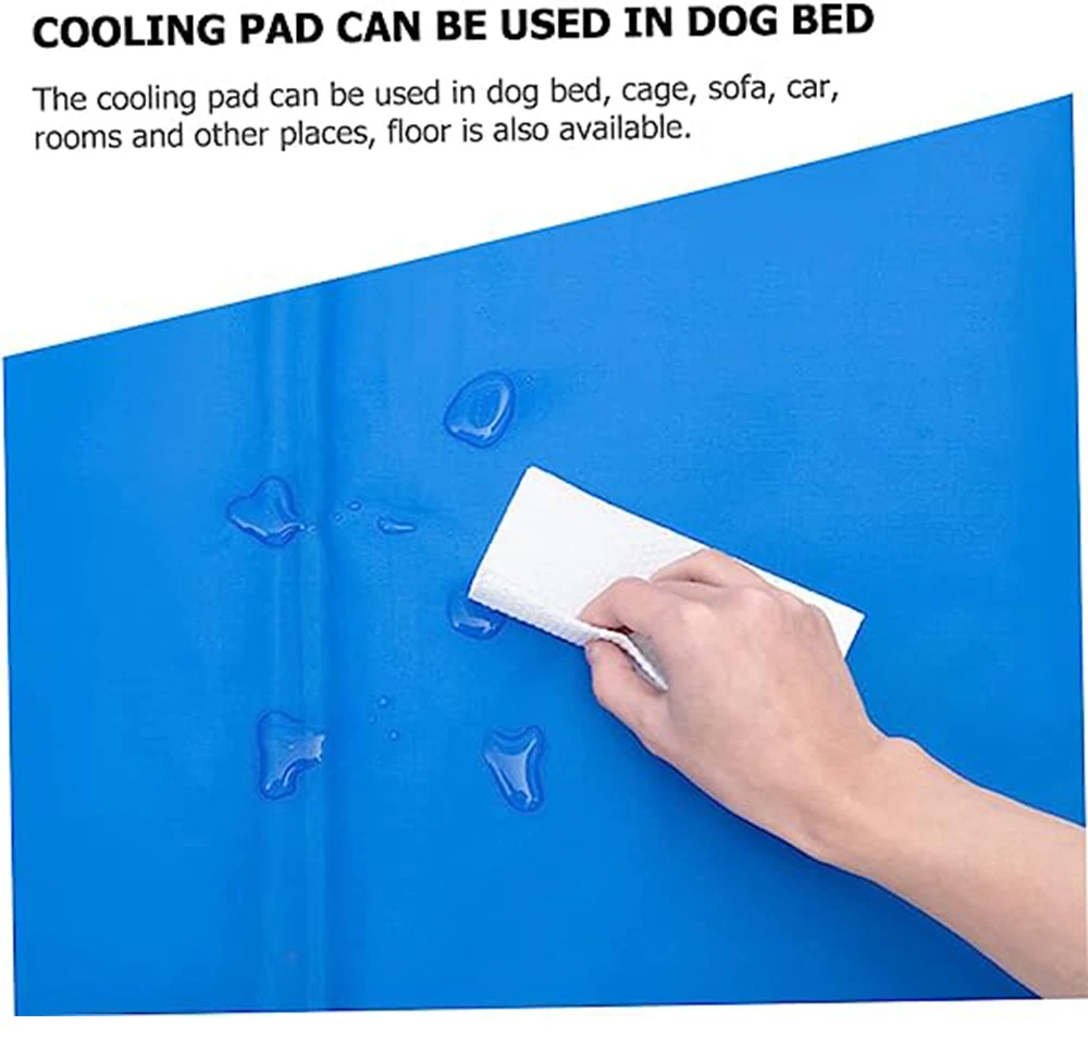 A hand wiping water droplets off a blue cooling pad.