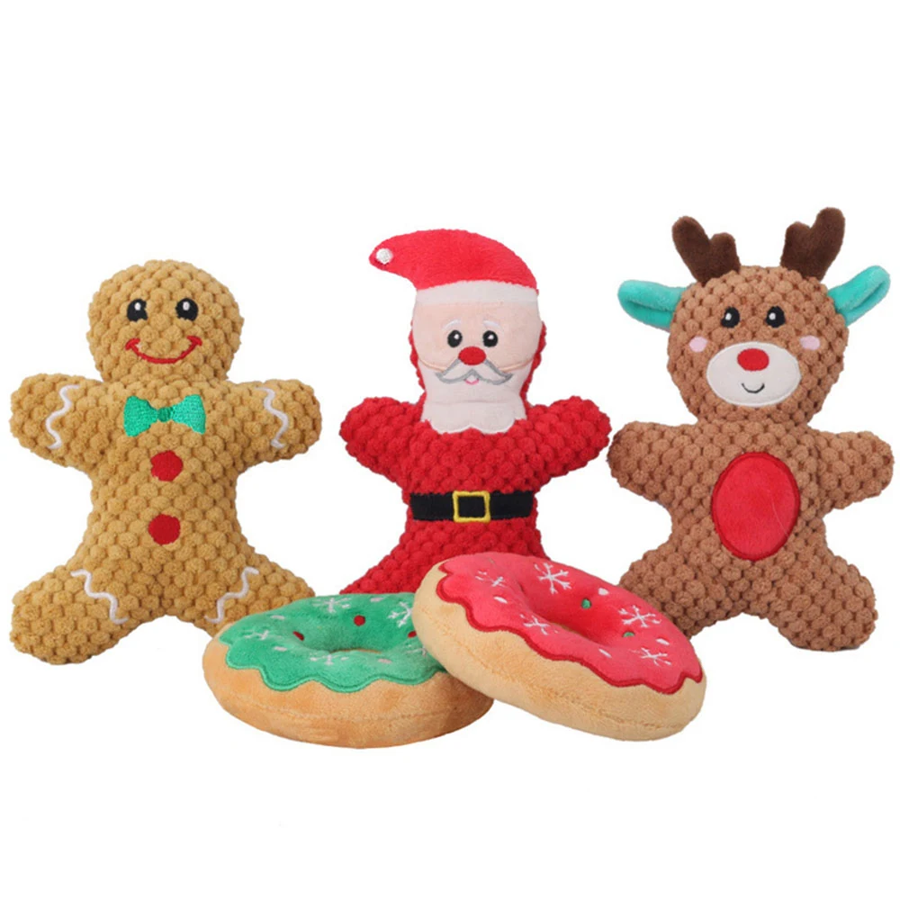 Assorted crocheted plush toys shaped like a gingerbread man, Santa Claus, reindeer, and two donuts.