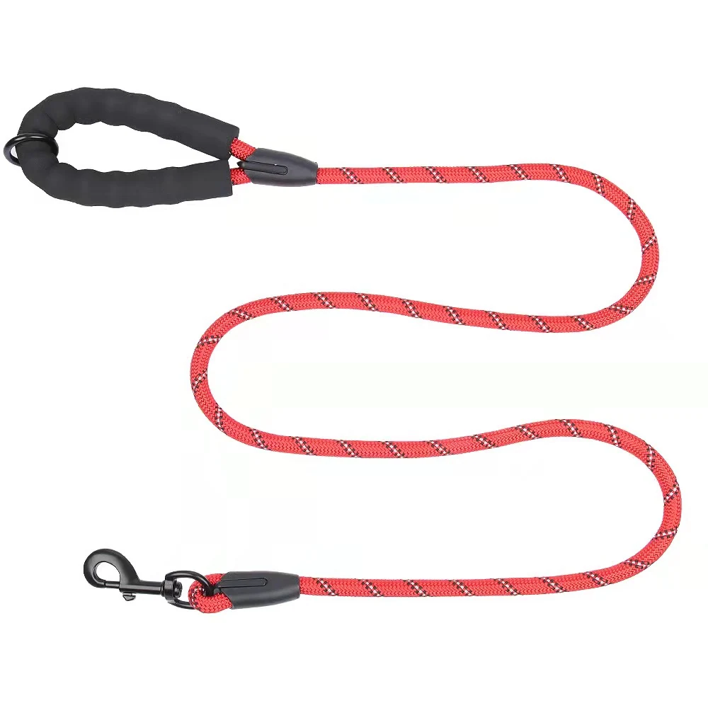 Red dog lead with black padded handle and metal clip on white background