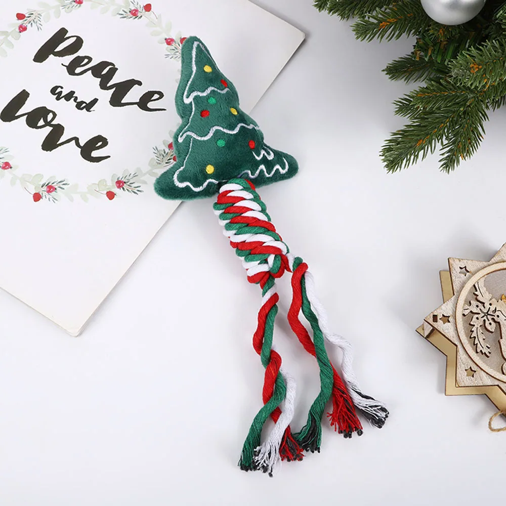 A plush Christmas tree cat toy with a braided red, white, and green rope tail.