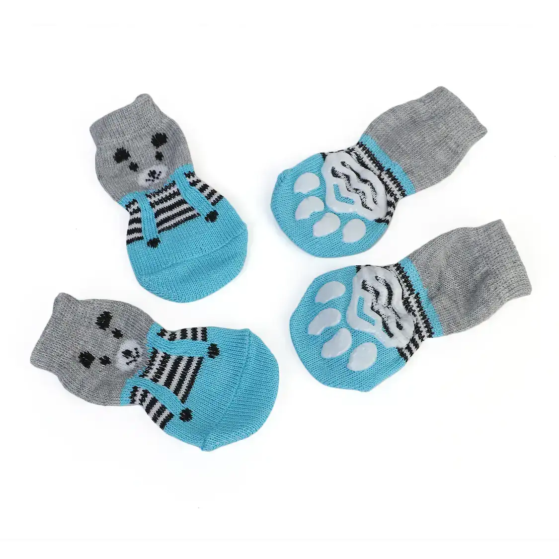 Four teal and grey knitted dog socks with paw prints and a dog face design.