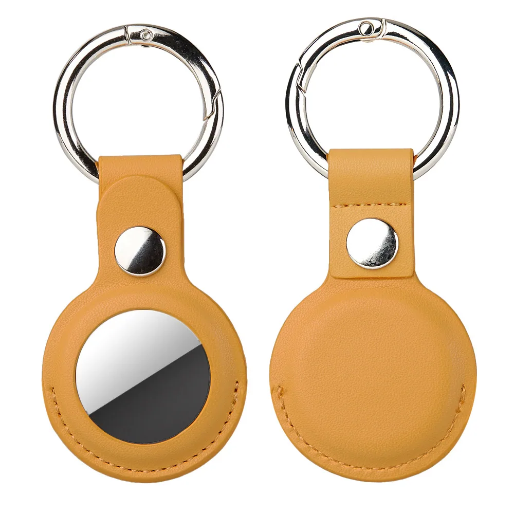 Front and back views of a tan leather keychain holder with a silver metal ring.