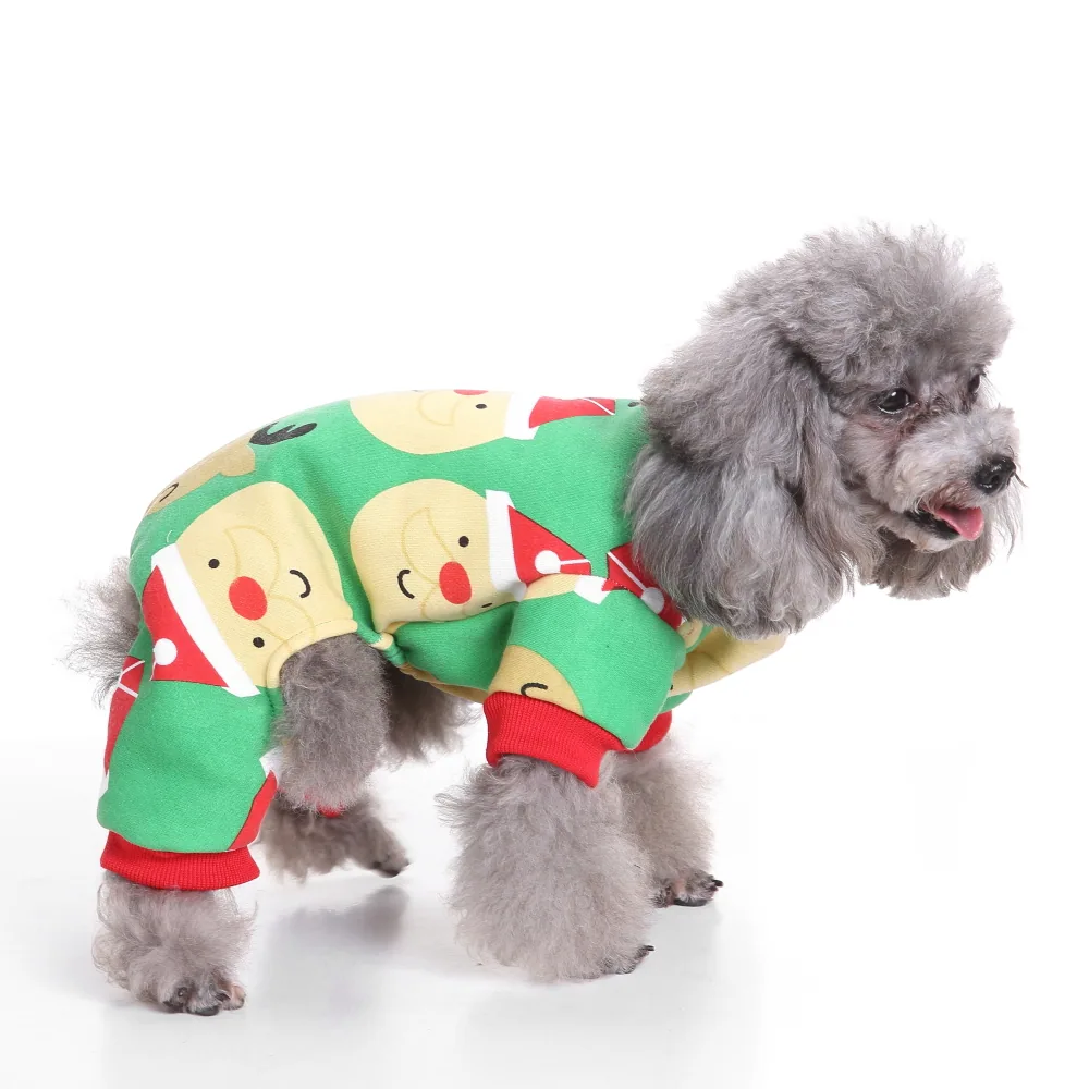 Grey poodle wearing a green and red Christmas costume with Santa faces.