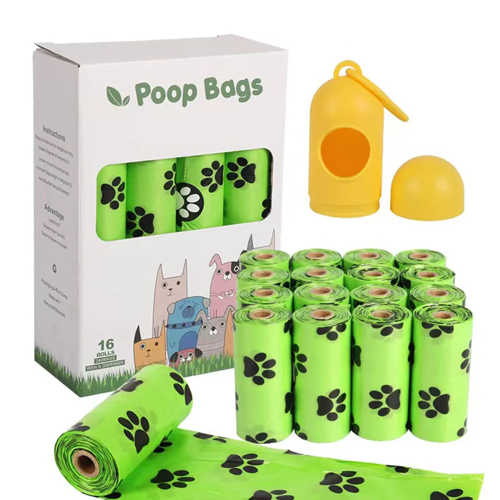 Green poop bags with black paw prints, a dispenser, and packaging box.