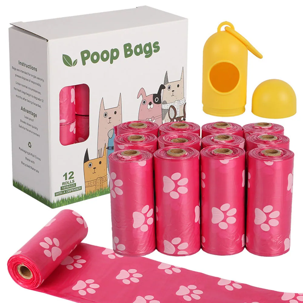 Pink dog poop bags with paw prints, packaging box, and yellow dispenser.