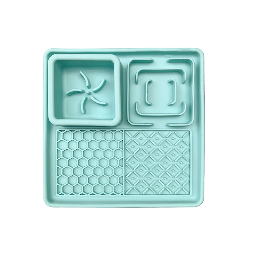 Top-down view of a light blue silicone tray with four sections featuring different geometric embossed patterns.