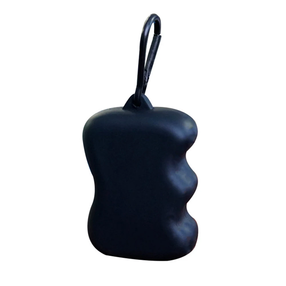 Black, textured object with a contoured, wavy side and a carabiner clip attached to the top.