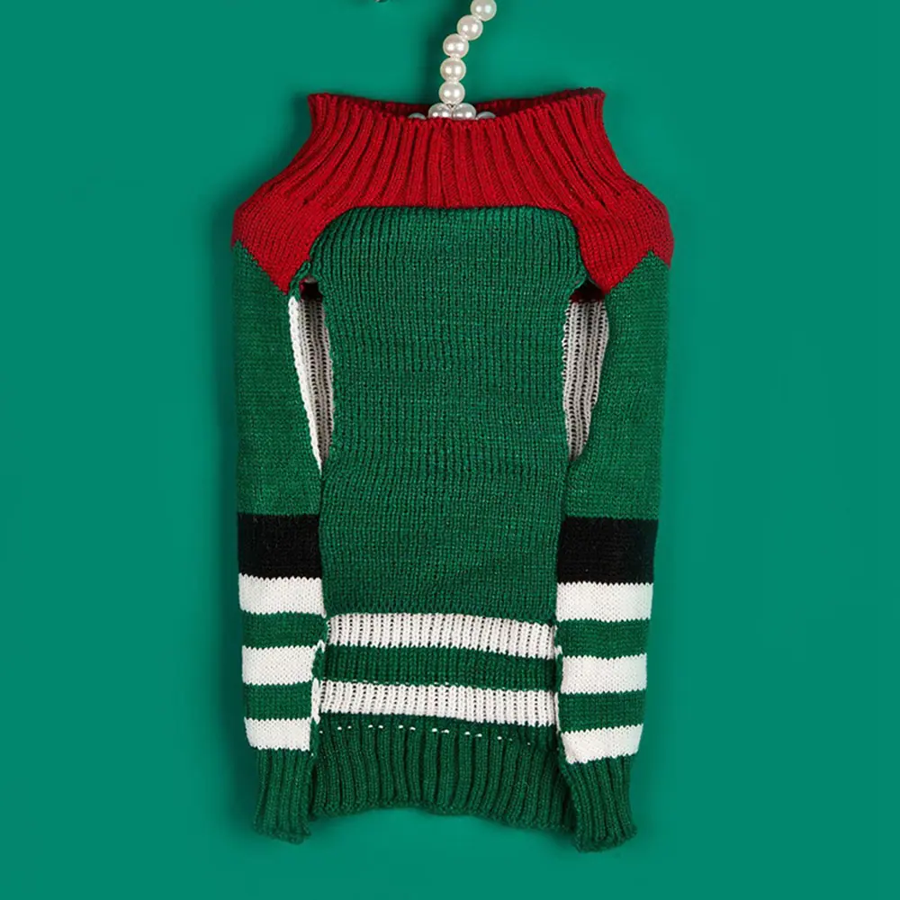 Green, red, and white striped knit sweater with a high neck and pearl necklace on a solid green background