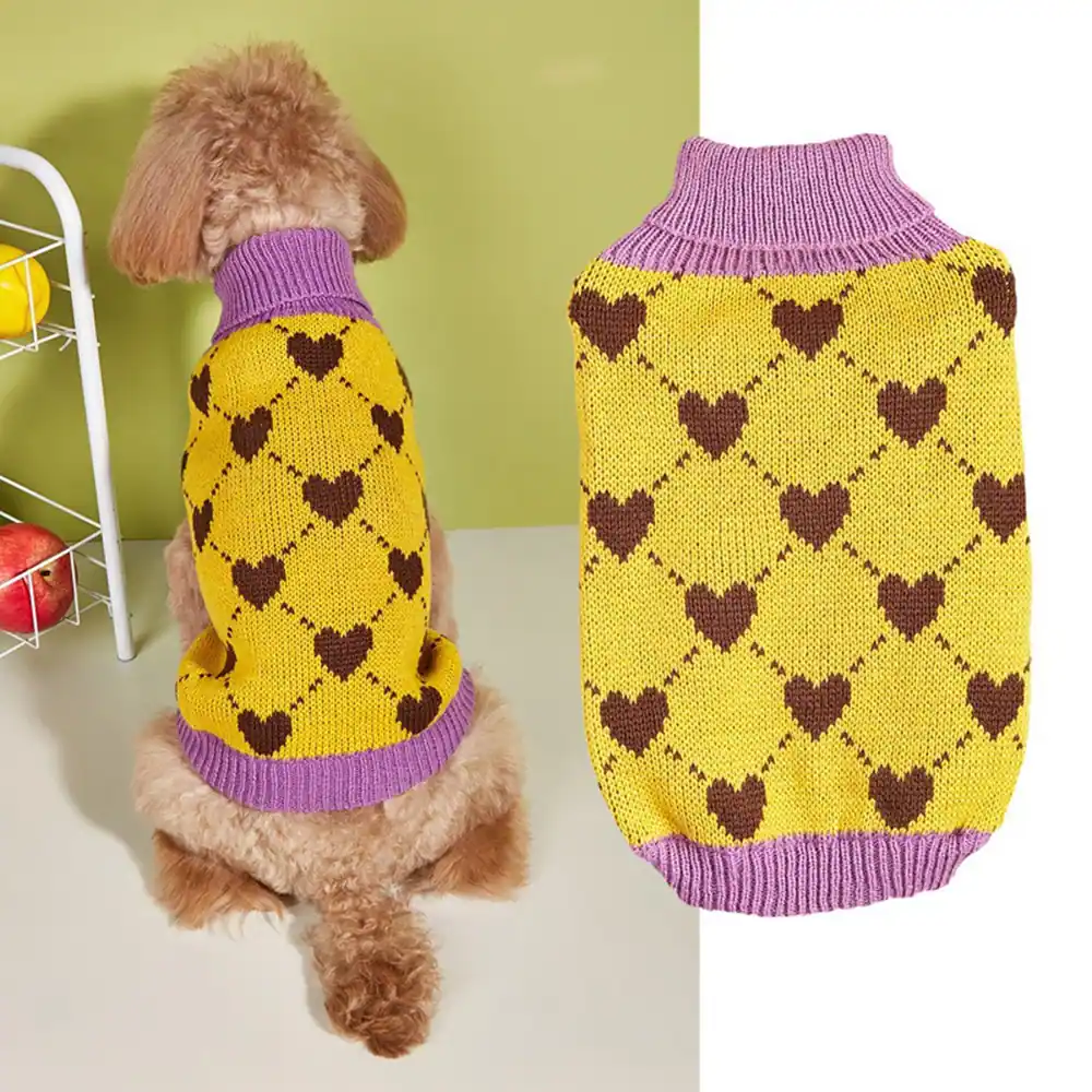 A yellow and purple knitted dog sweater with a brown heart pattern, shown worn by a poodle and as a standalone item.
