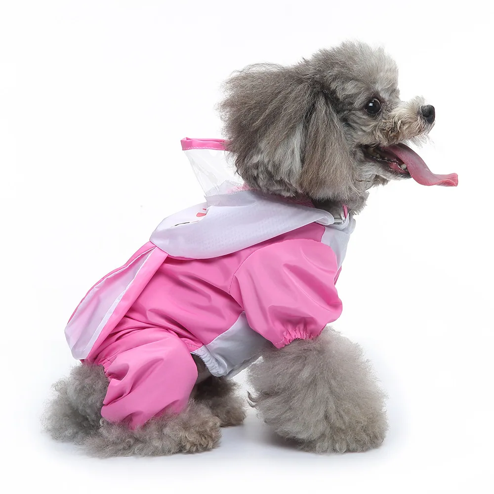 Gray poodle sitting in profile wearing a pink and white hooded raincoat.