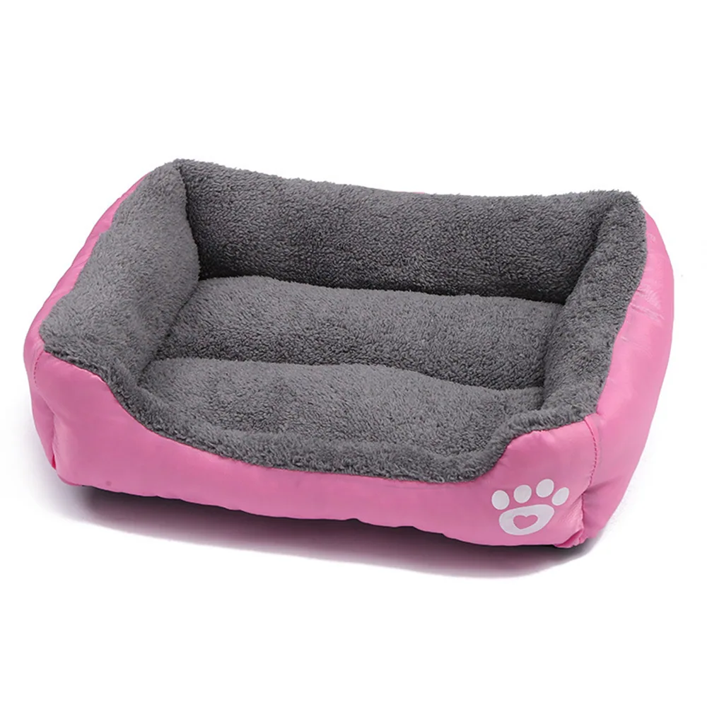 Pink and grey rectangular pet bed with paw print design on side