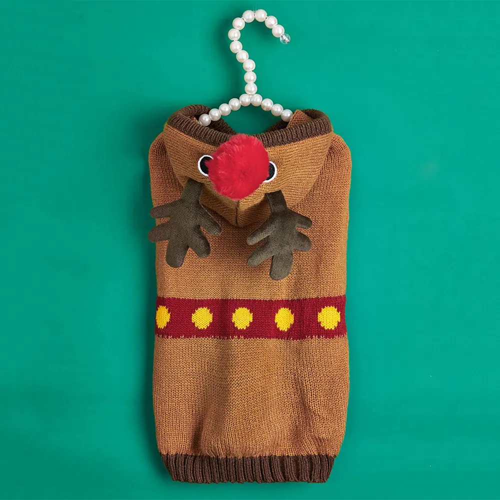 Knitted brown reindeer costume hanging on a beaded hanger against a green background