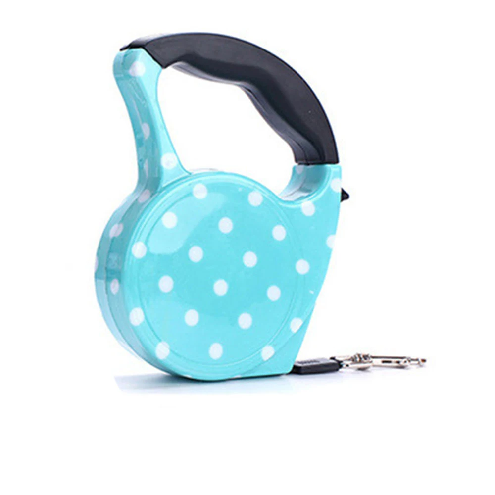 Turquoise retractable dog leash with white polka dots and black handle