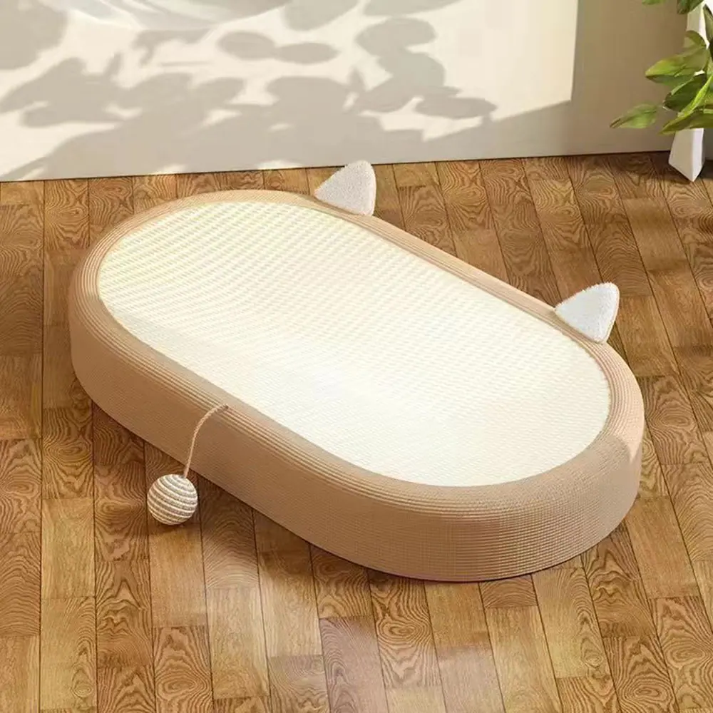 Cat scratcher lounge with ears and a ball toy on a wooden floor