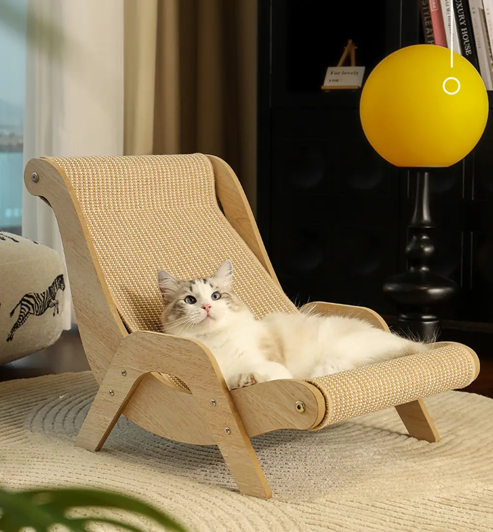 A white and grey cat relaxing on a wooden lounge chair with a beige textured surface.