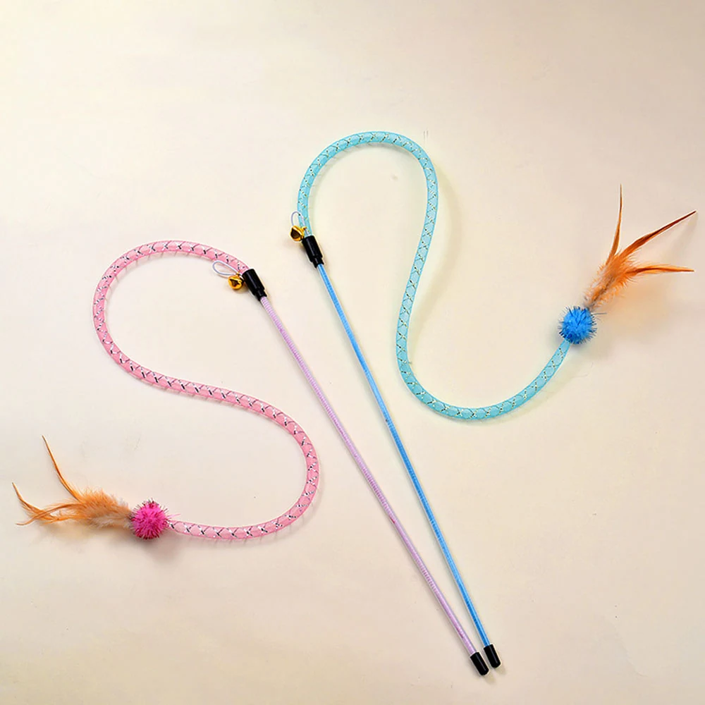 Two cat wand toys with pink and blue handles and curly string ends featuring feathers and pom-poms.