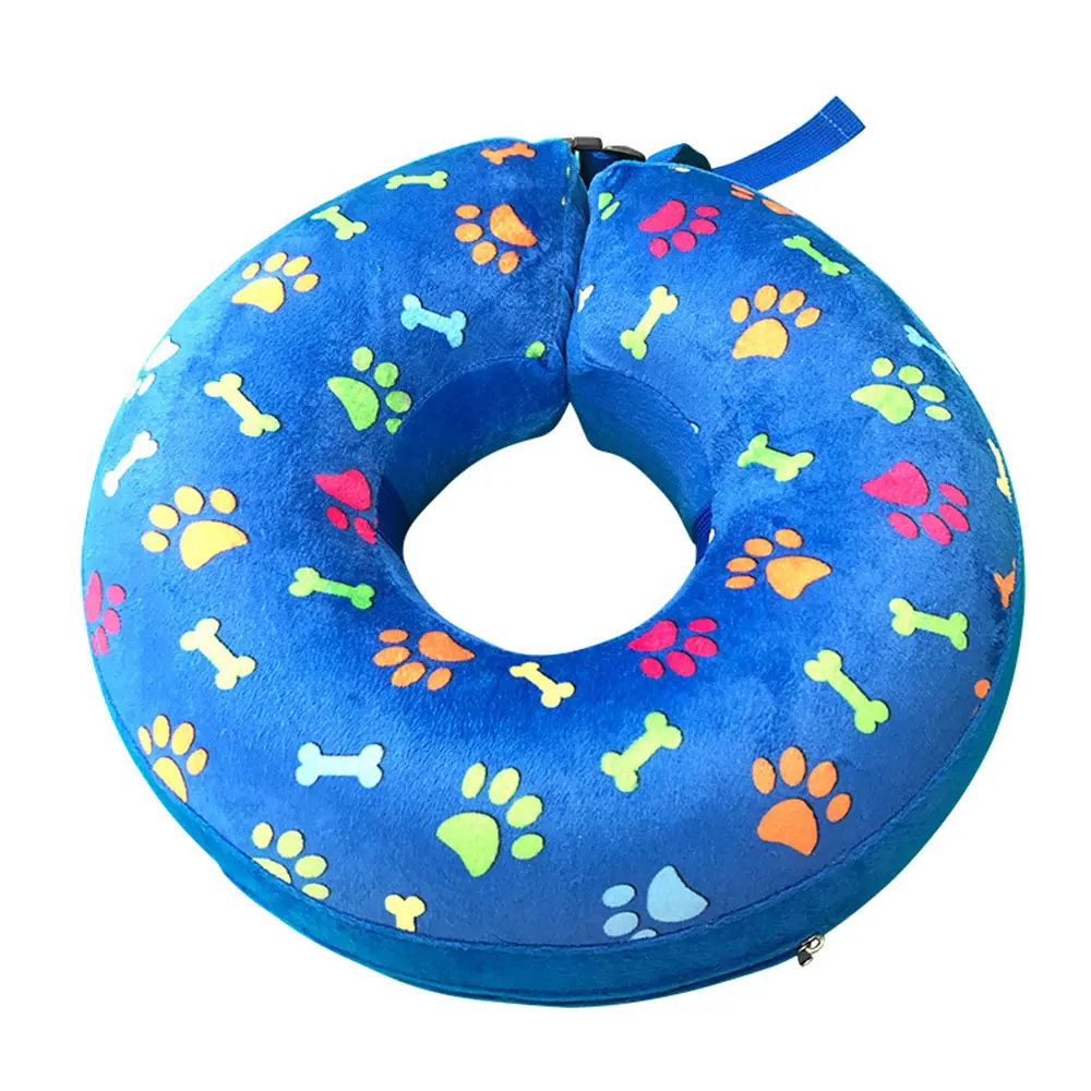 Blue inflatable pet recovery collar printed with colorful paw prints and bone shapes.