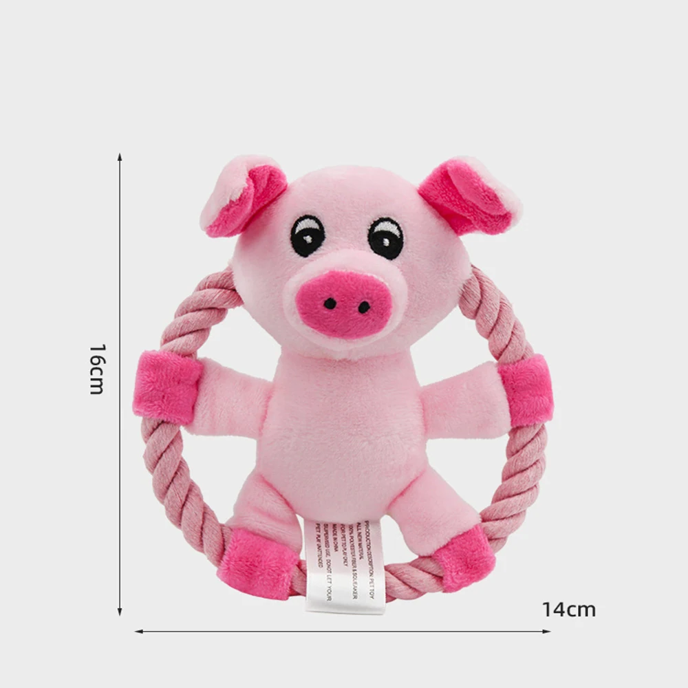 Pink plush pig dog toy attached to a rope ring with dimension indicators.