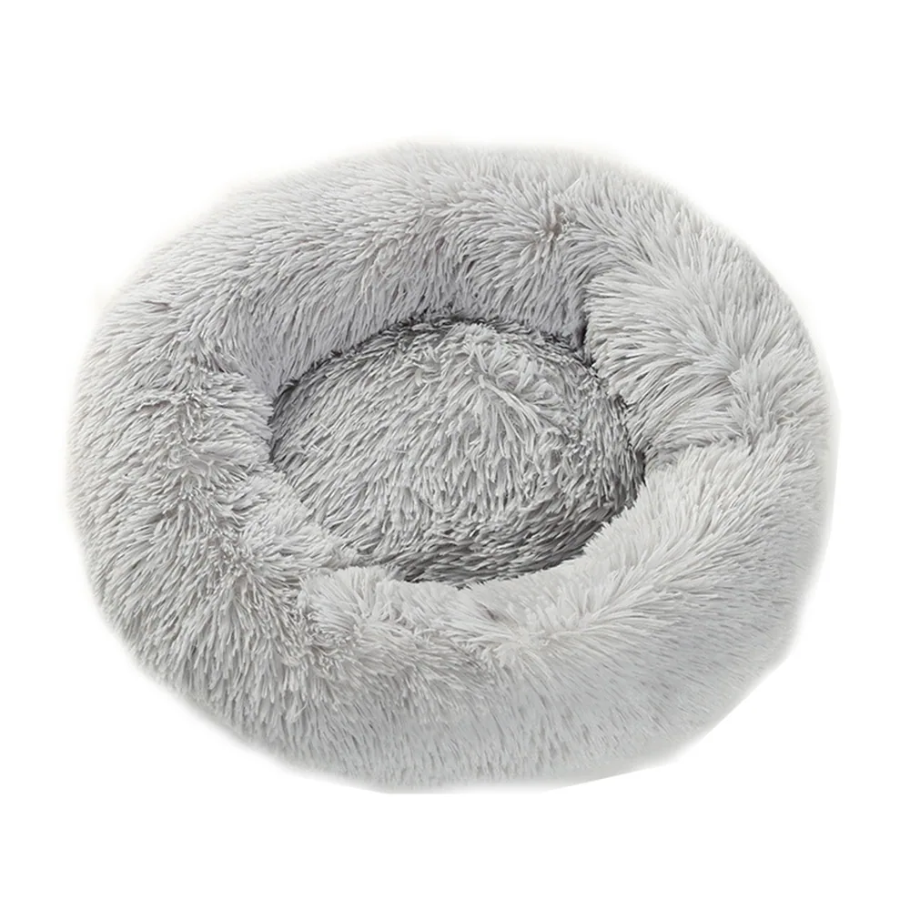 A round, fluffy gray pet bed with a raised rim and soft center.