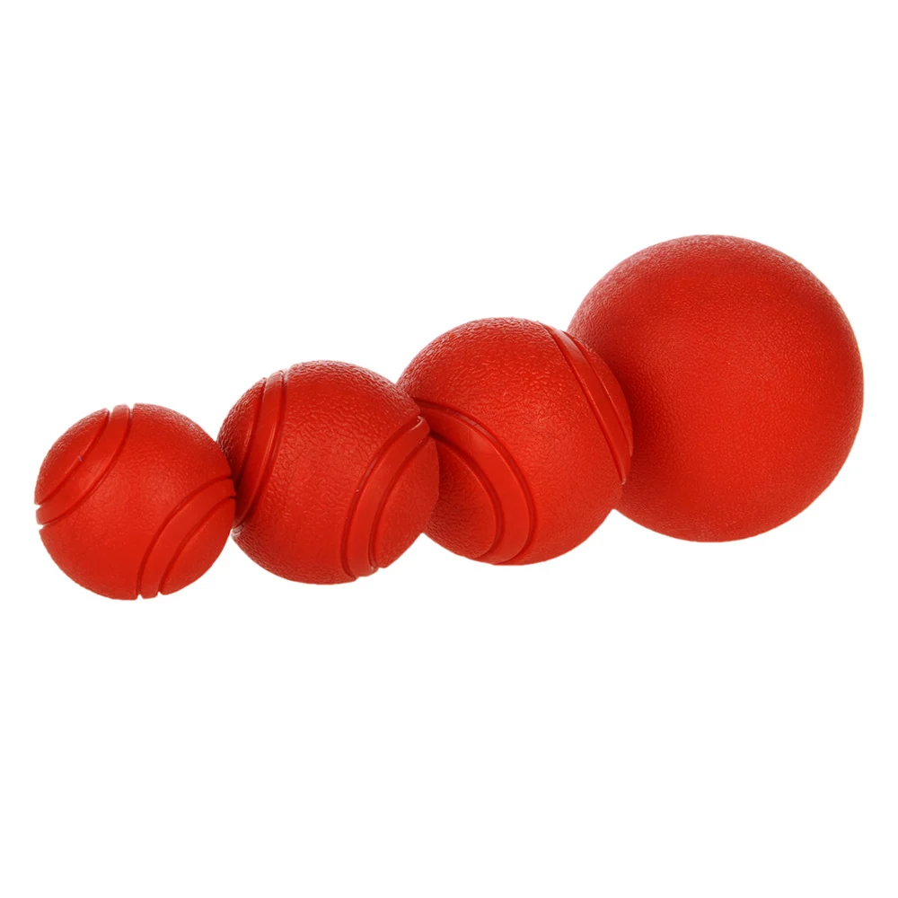 Four red textured rubber balls of increasing size arranged diagonally on a white background