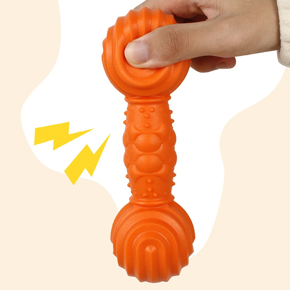 Hand holding a textured orange dumbbell-shaped object with graphic lightning bolts