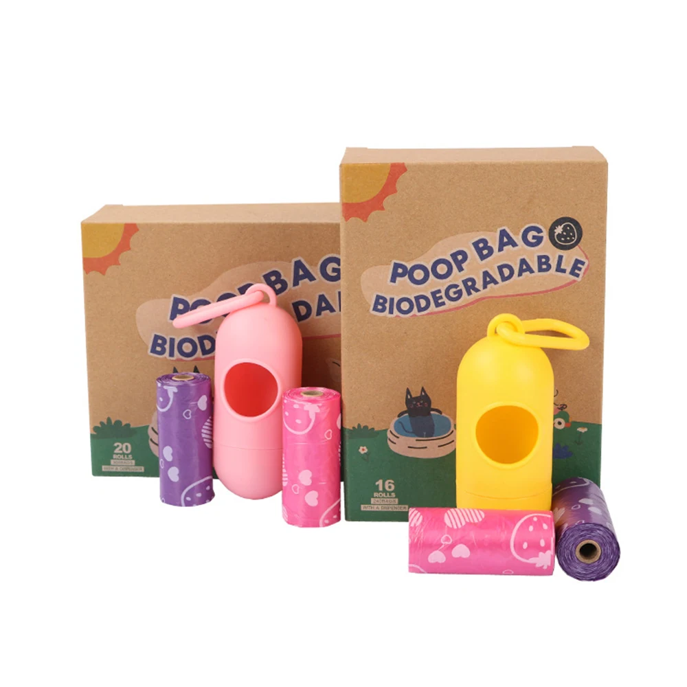 Biodegradable dog poop bag rolls, plastic dispensers, and cardboard packaging.