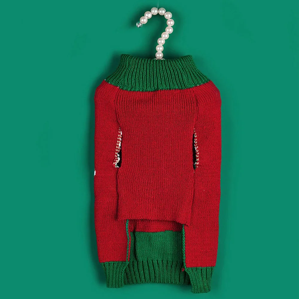 Red and green knitted pet sweater displayed on a pearl hanger