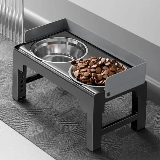 Elevated stainless steel pet feeder stand holding two metal bowls, one filled with kibble
