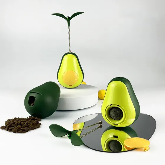 Avocado-shaped coffee bean storage and grinding container set with a mirror reflection.