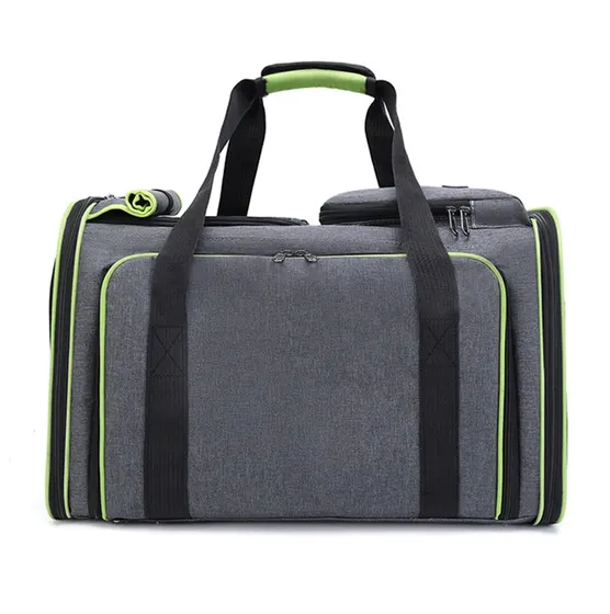 Grey fabric duffel bag with black handles and green zipper accents on a white background
