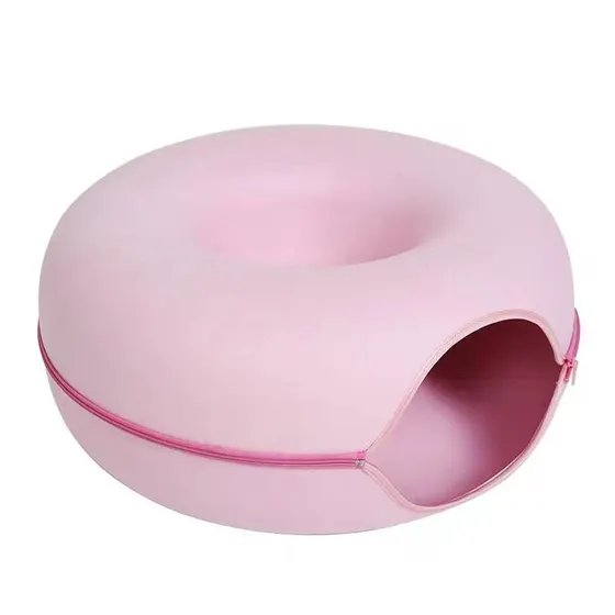 Pink donut-shaped soft shell with a zipper opening around the side.